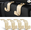 Amooca 4-Pack Car Headrest Hooks Vehicle Storage Organizer for Purses Handbags Groceries Coats –Holds 55lbs 360° Rotating Simple Design Beige